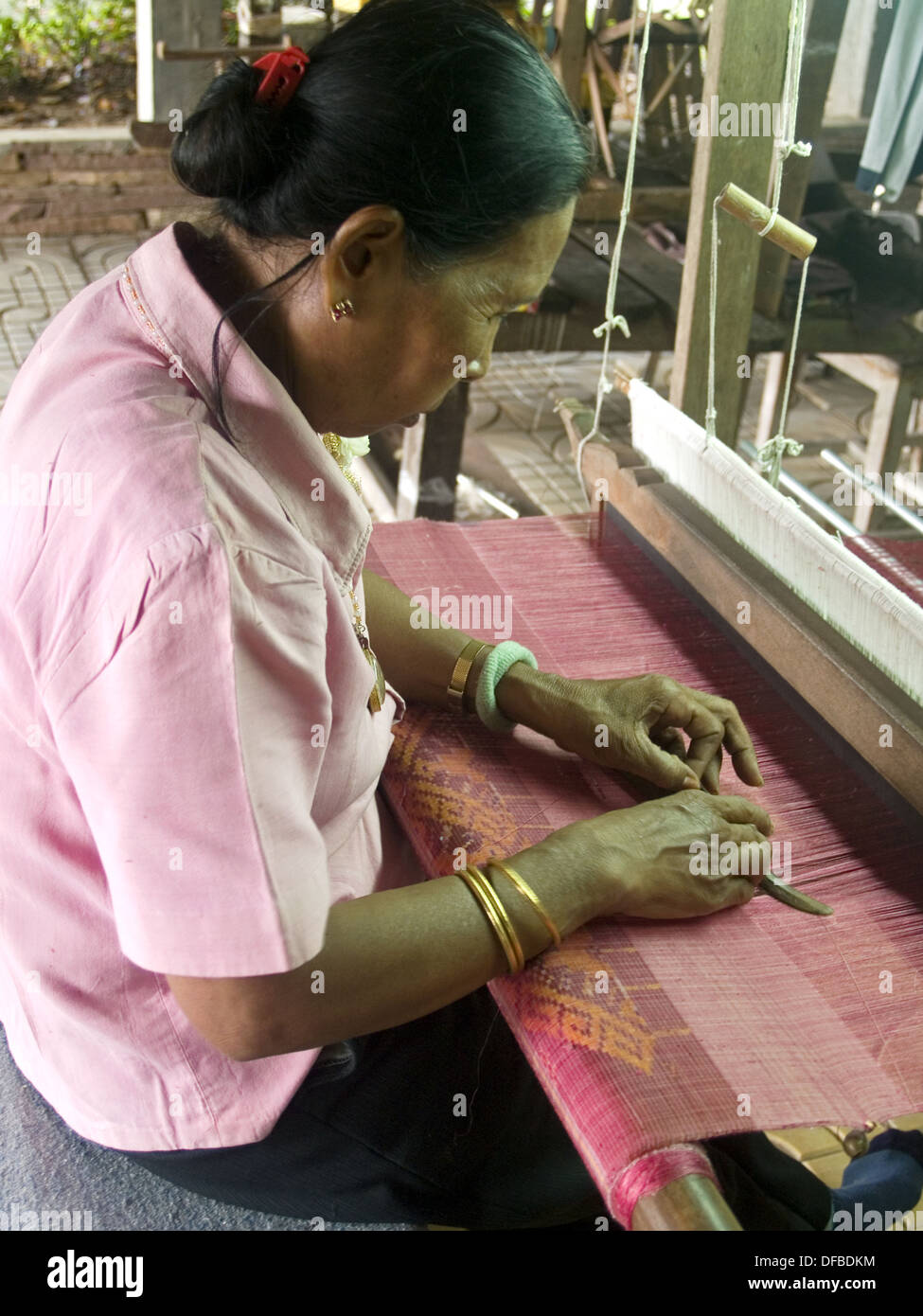 weaving silk thread at the Queen Sirikit Sericulture Center in Surin