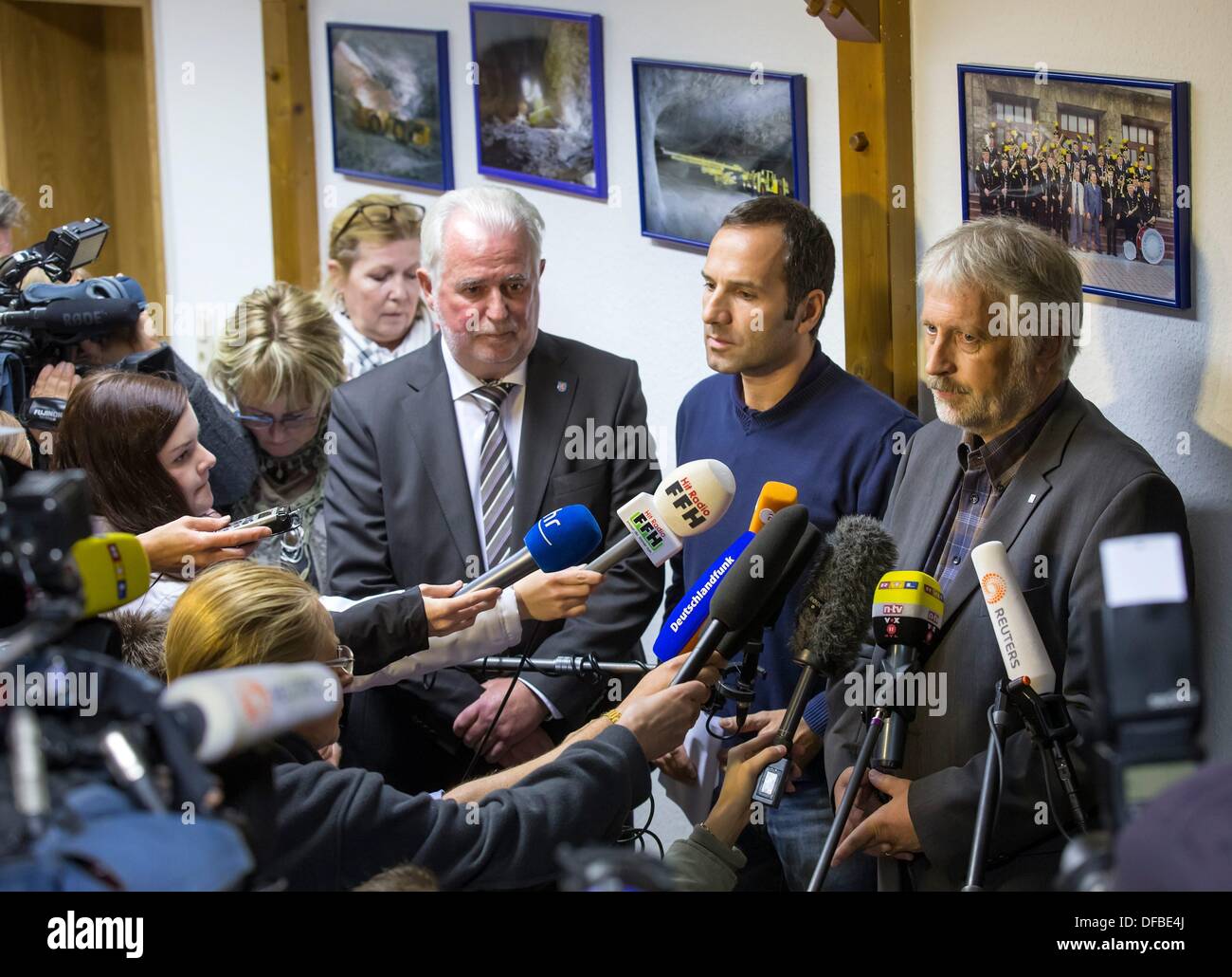 Unterbreizbach, Germany. 01st Oct, 2013. Environment minister of Thuringia Juergen Reinholz (L-R), K S press spokesman Michael Wudonig and Rainer Gerling, factory manager of the Werra Factory, talks during a press conference about the mining accident in Unterbreizbach, Germany, 01 October 2013. Photo: MICHAEL REICHEL/dpa/Alamy Live News Stock Photo
