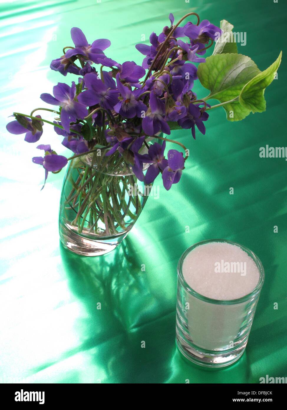 Violets, edible flowers and sugar Stock Photo Alamy
