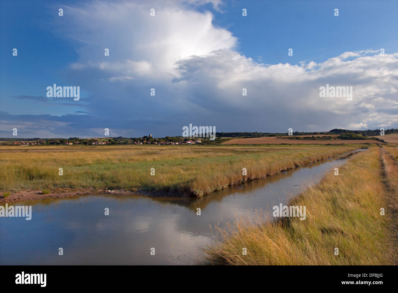 Salthouse Village church and grazing marshes Norfolk Stock Photo