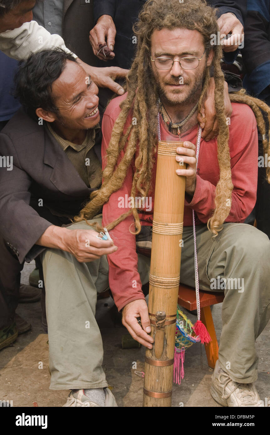 dreadlocked Spanish tourist taking a bong hit in Yuanyang China Stock Photo  - Alamy