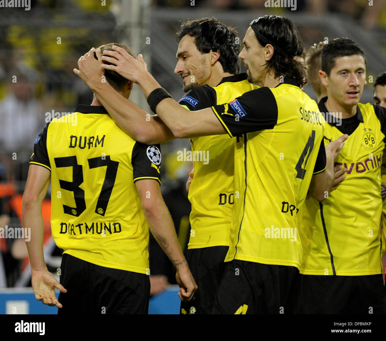 Dortmund, Germany . 01st Oct, 2013. UEFA Champions League 2013/14, 1.10.2013, Group phase, 2nd matchday, Signal Iduna Arena, Dortmund, Borussia Dortmund- Olympique Marseille ---- Mats Hummels (2nd.from left) and Neven Subotic congratulate Eric Durm in celebration of Durms assits for the goal of the 1:0, scored by Robert Lewandowski (right) , all Dortmund © kolvenbach/Alamy Live News Stock Photo