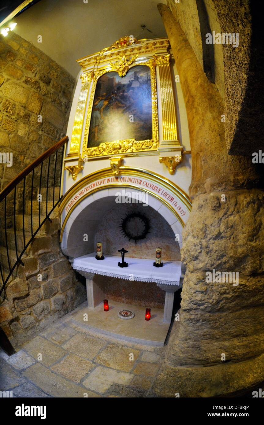 View of the altar, the seventh station of the Via Dolorosa in Jerusalem, Israel, 12 September 2013. According to deliverance, Jesus fell at this place for a second time. The pillar on the right is from the Byzantinian Era; the small chapel at the station belongs to the Franciscans today. The Via Dolorosa (Way of Suffering) is a street in the old town of Jerusalem named after the path Jesus of Nazareth walked to his crucification. Jesus carried the cross, on which he later died via that road from the Antonia Fortress, then seat of Pilate, to Golgotha, the place where his grave is supposedly loc Stock Photo