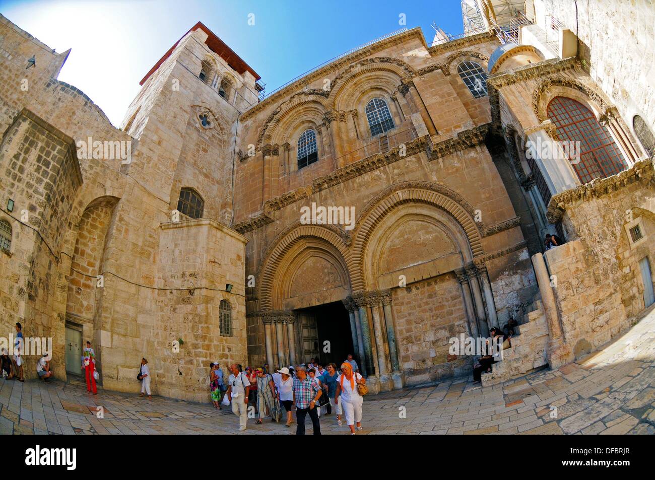 View of the entrance of the Church of the Holy Sepulchre, which contains the last five stations of the Via Dolorosa, in Jerusalem, Israel, 12 September 2013. The Via Dolorosa (Way of Suffering) is a street in the old town of Jerusalem named after the path Jesus of Nazareth walked to his crucification. Jesus carried the cross, on which he later died via that road from the Antonia Fortress, then seat of Pilate, to Golgotha, the place where his grave is supposedly located. Above this place, the Church of the Holy Sepulchre was later built. The path led Jesus via 14 stations that are often visited Stock Photo