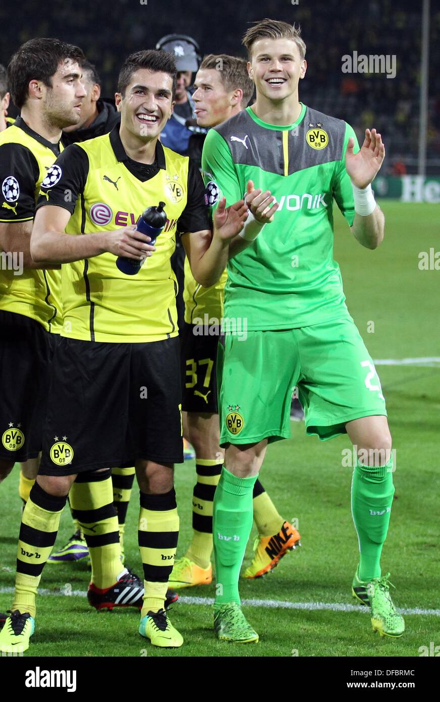 Dortmund, Germany. 01st Oct, 2013. Borussia Dortmund's Nuri Sahin (L-R) and Mitchell Langerak celebrate after their 3-0 win in the Champions League Group F match between Borussia Dortmund and Olympique Marseille in Dortmund, Germany, 01 October 2013. Photo: Friso Gentsch/dpa/Alamy Live News Stock Photo