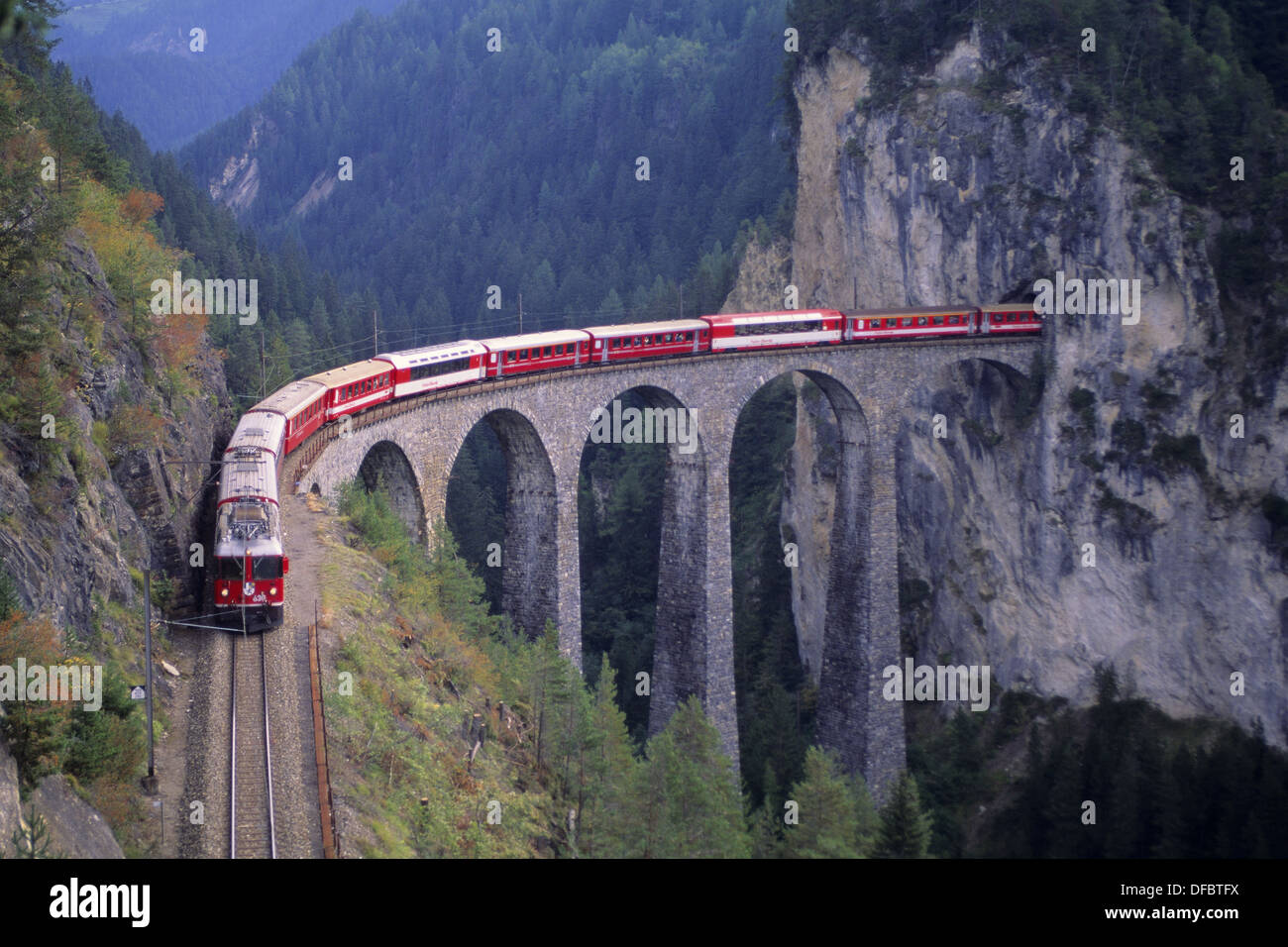passenger train on the tallest rock bridge in Switzerland Stock Photo
