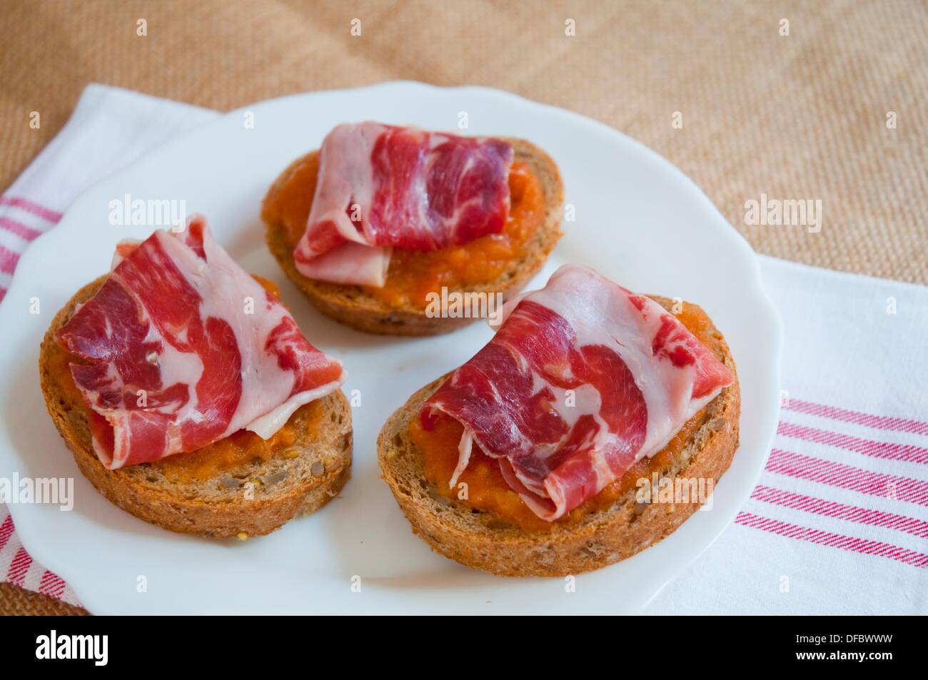Spanish tapa Iberian ham and tomato sauce Spain Stock Photo Alamy
