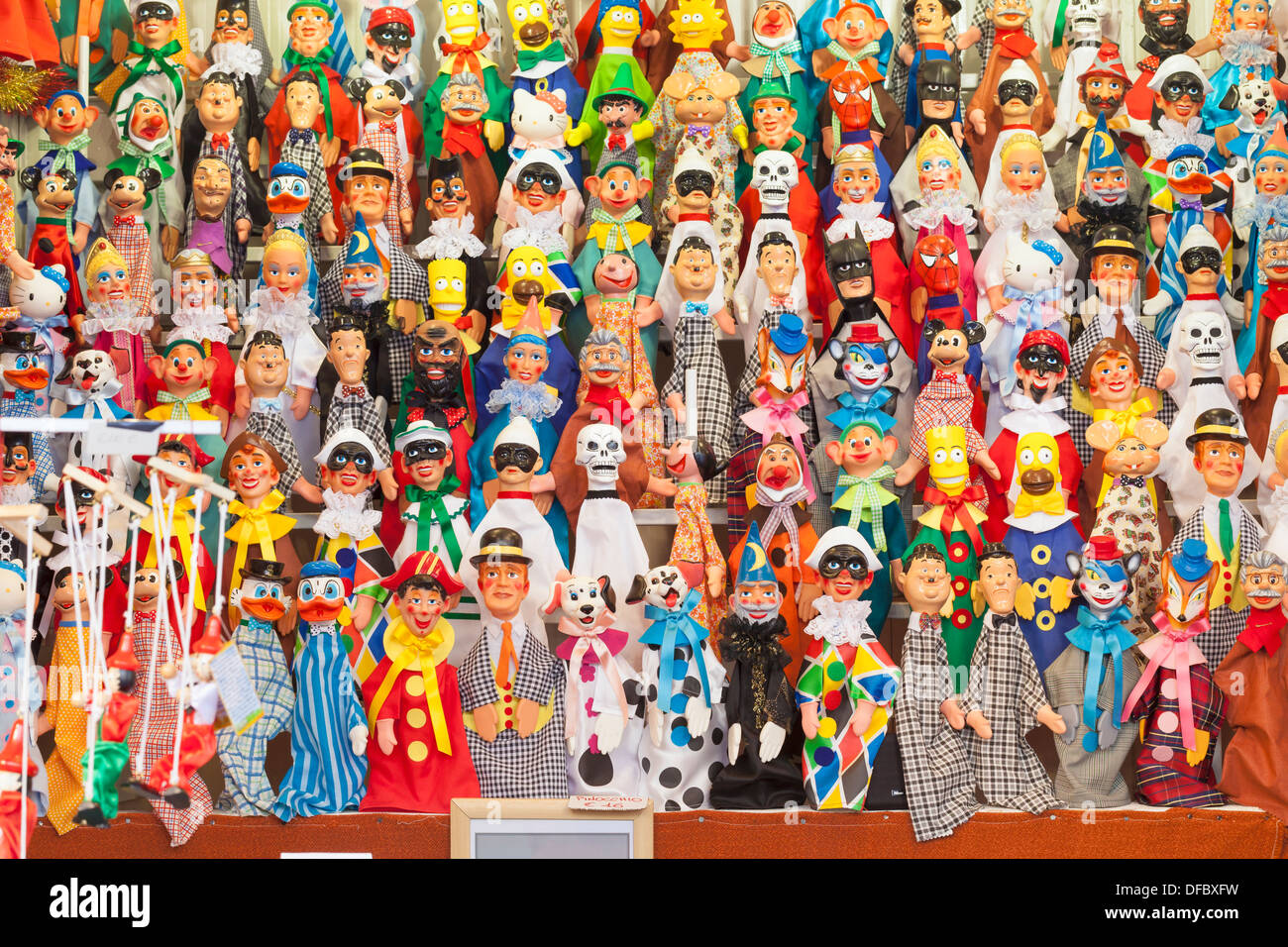 Puppets on display at a market stall in Navona Square, Rome, Italy