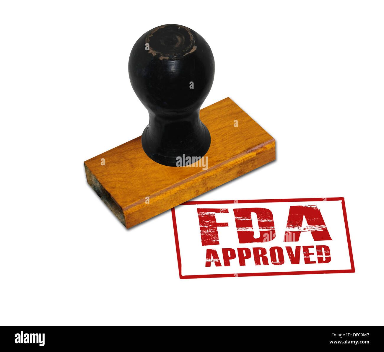 An office rubber stamp with text 'FDA Approved' punched in red Stock Photo