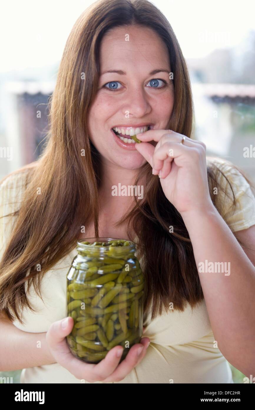 Pregnant woman eating gherkin hires stock photography and images Alamy