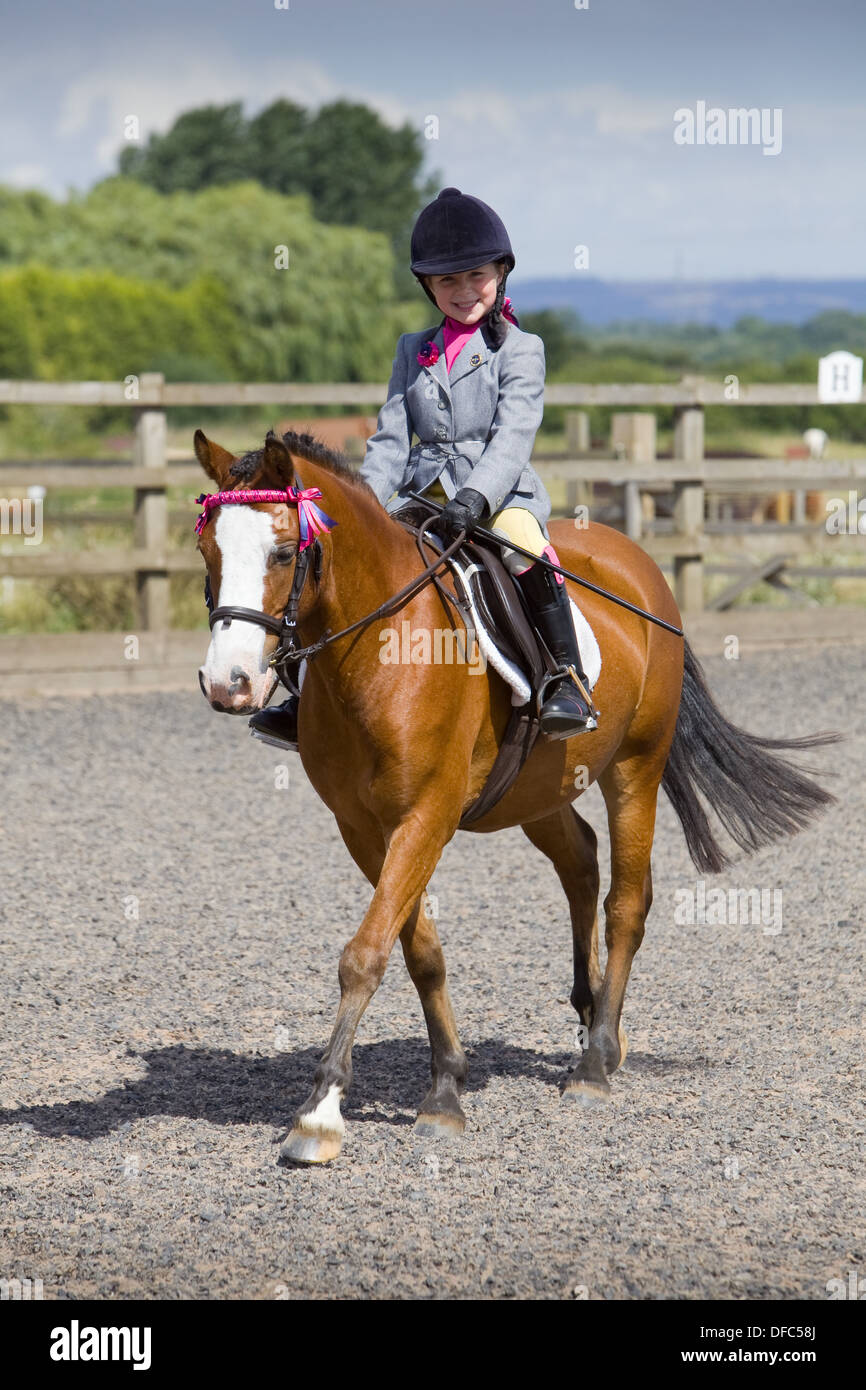 A competitor with their horse at an outdoor equestrian competition Stock Photo