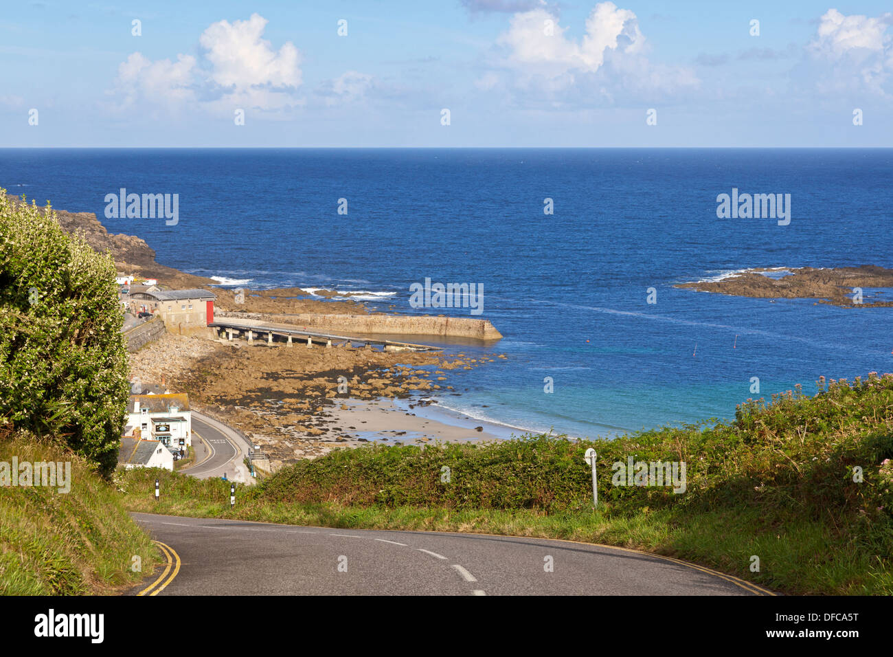 On a summers day as you drive down the hill to Sennen Cove in Cornwall you are greeted by this first glimpse of the sea Stock Photo