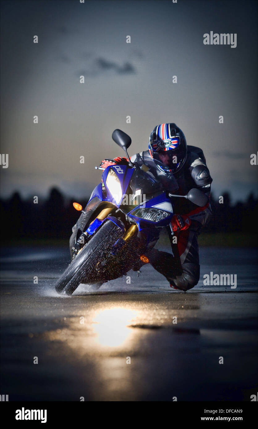 Biker Getting His Knee Down While Cornering In The Wet Stock Photo Alamy