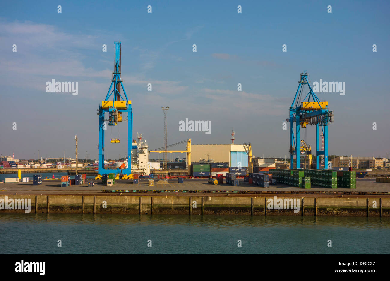 Zeebrugge port and container terminal, commerce, with ships, cranes and containers Stock Photo