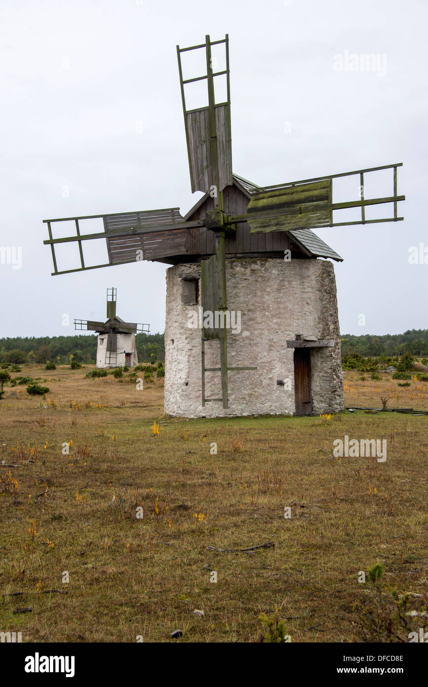Old stone windmills in a field on the west coast of Gotland in Sweden Stock Photo