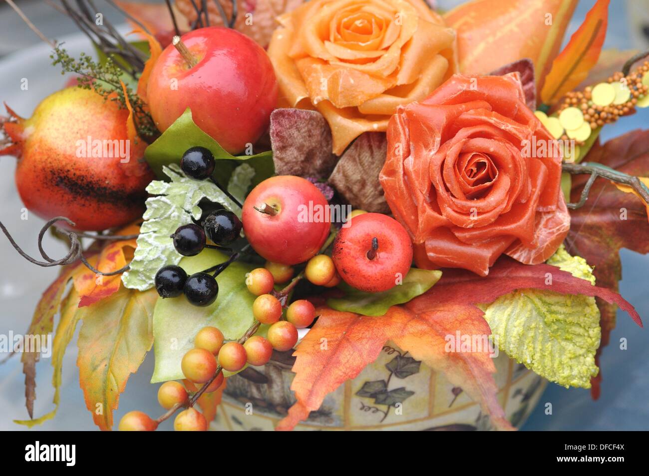 Branch or stick adorned with artificial flowers hires stock