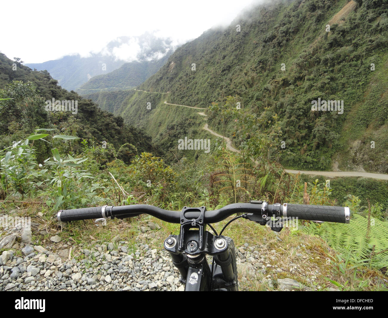 Mountain bikers take on the 'Worlds most dangerous road', from La Paz to Coroico, Bolivia Stock Photo