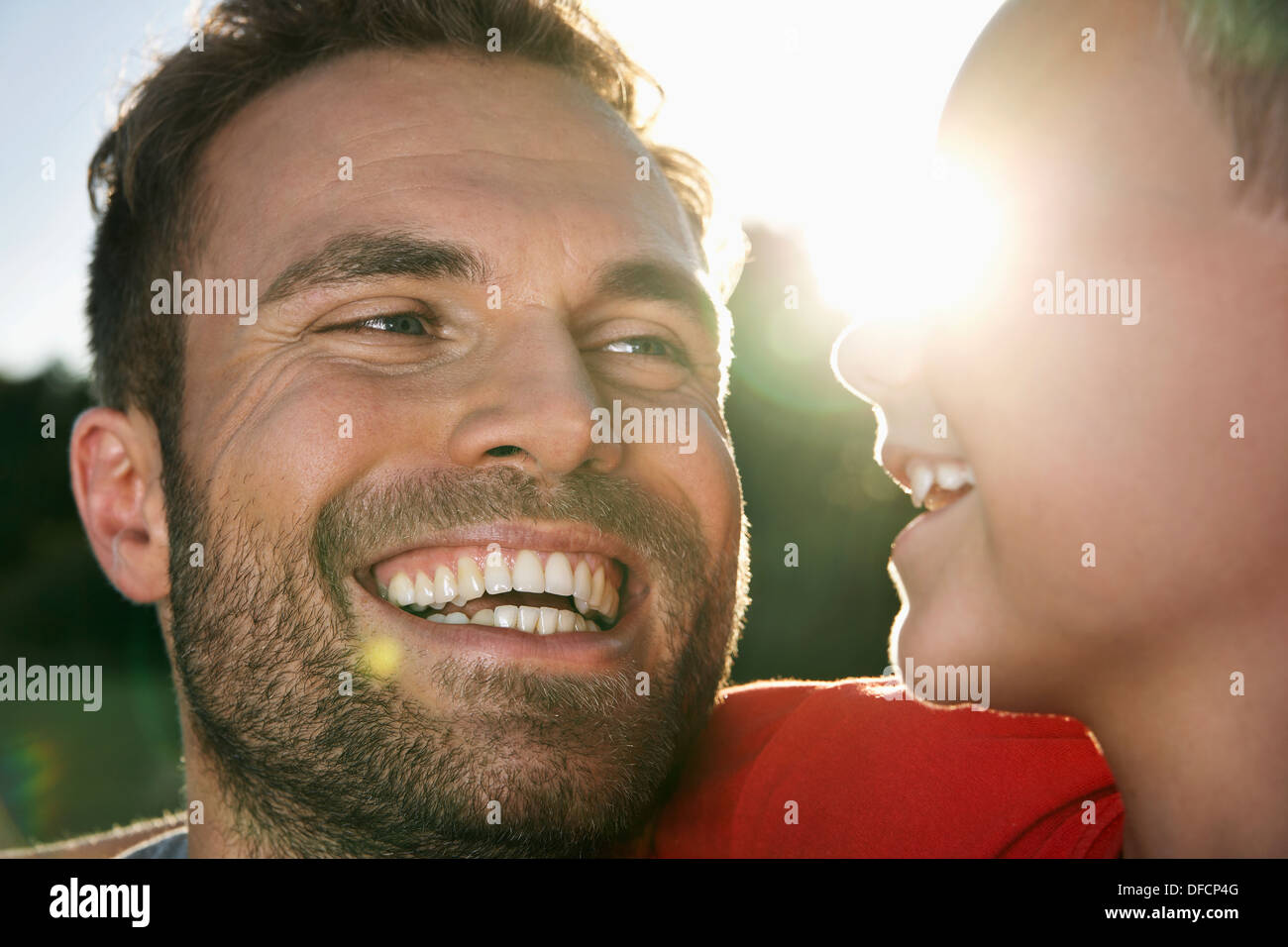 Germany, Cologne, Father and son, smiling Stock Photo Alamy