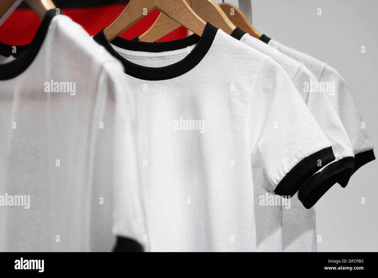 Football shirts on clothes hangers studio shot Stock Photo Alamy