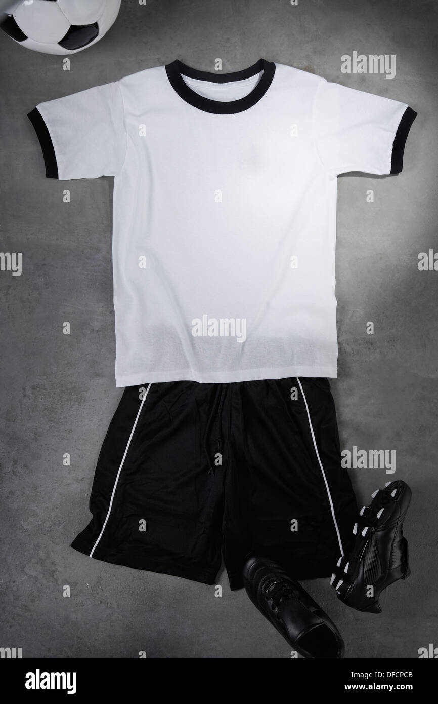 Football shirt and pants spread on floor, studio shot Stock Photo Alamy
