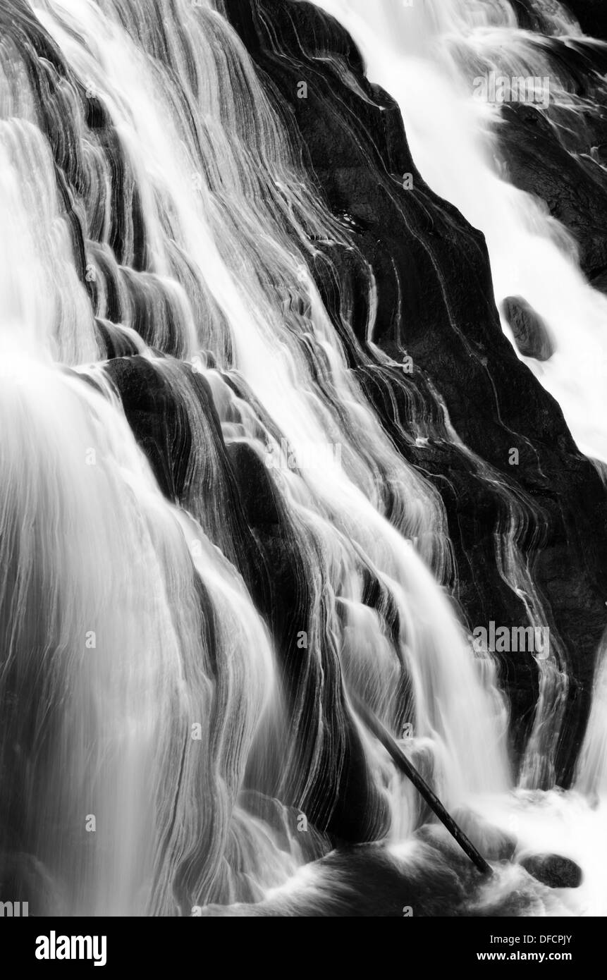 Gibbon Falls cascading down rocks in Yellowstone National Park Stock Photo