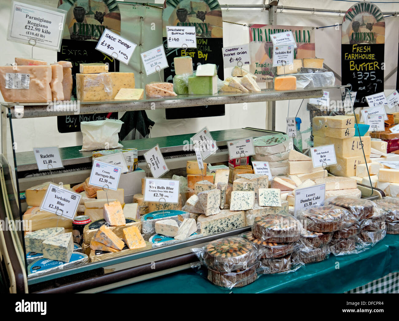 Cakes cake and Cheese Cheeses market stall display counter at the