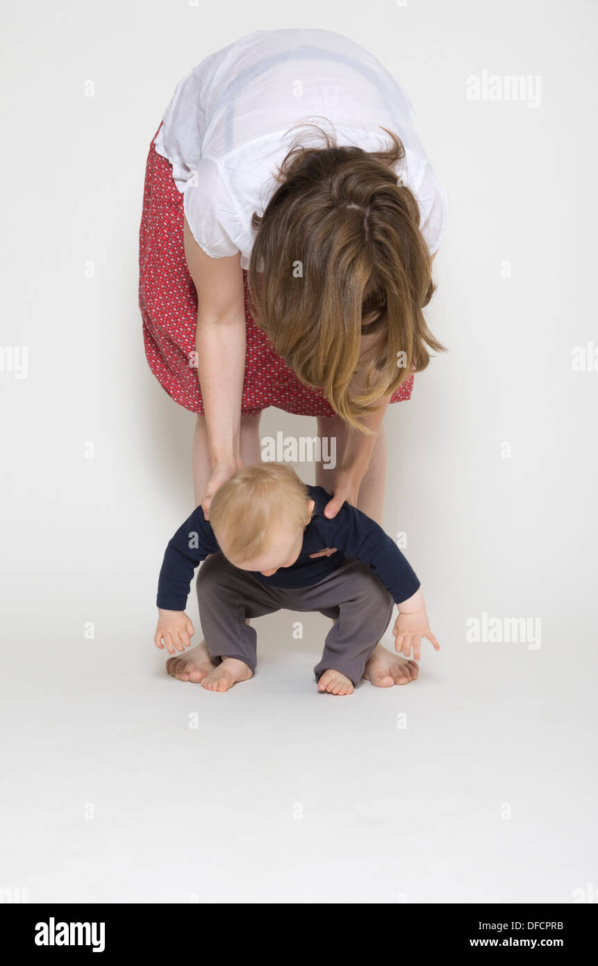 Baby boy learning to walk hi-res stock photography and images - Alamy