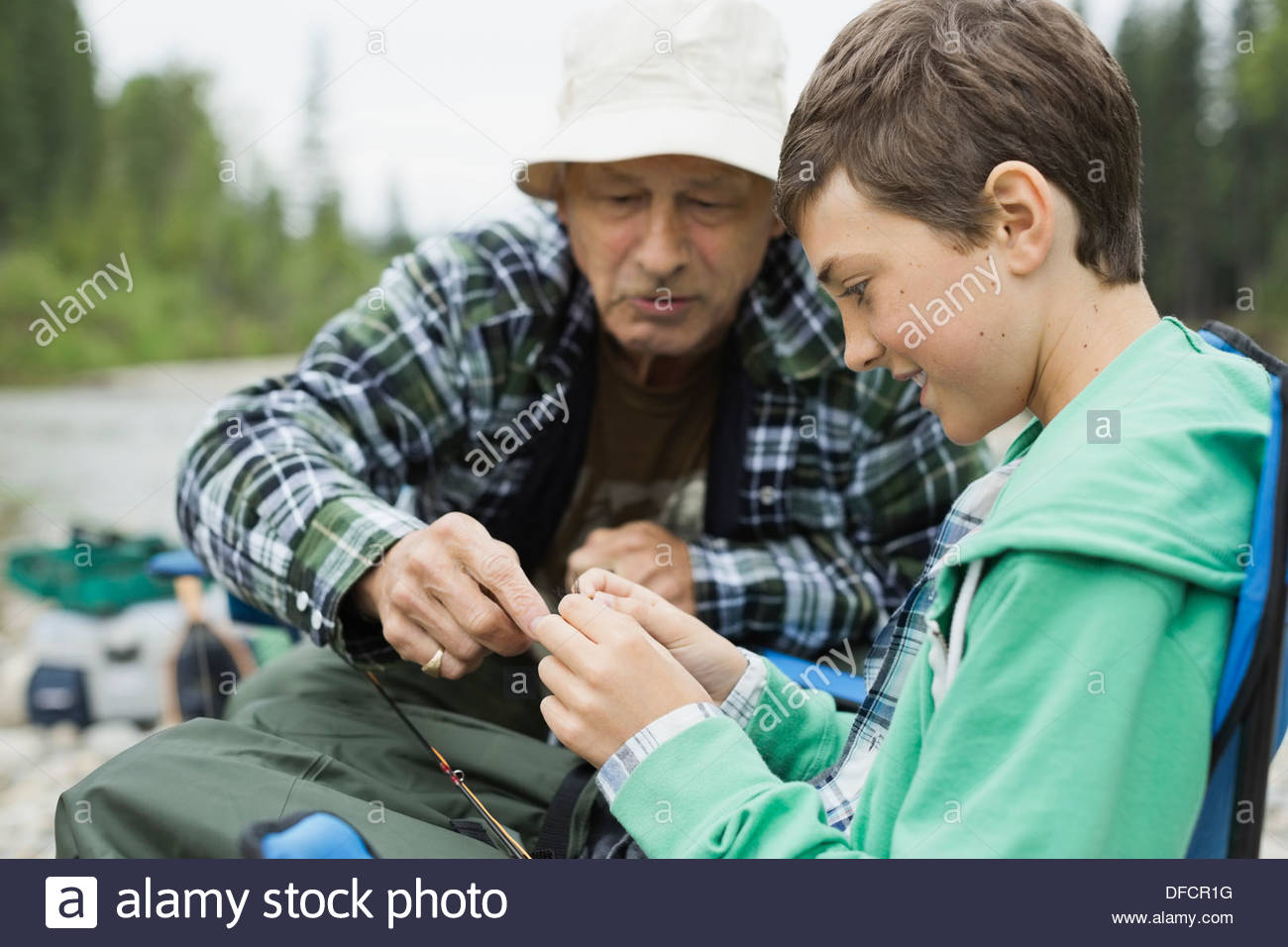 Two boys sitting fishing hi-res stock photography and images - Alamy