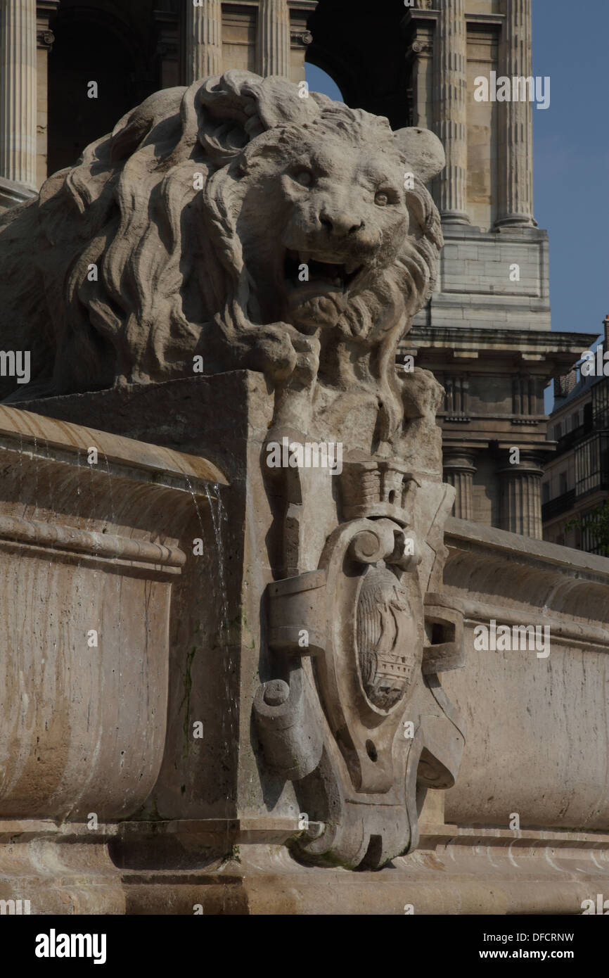 One of the four lions of the XIX siecle fountain by Louis Visconti in place Saint Sulpice which shows the coat of arm of Paris Stock Photo