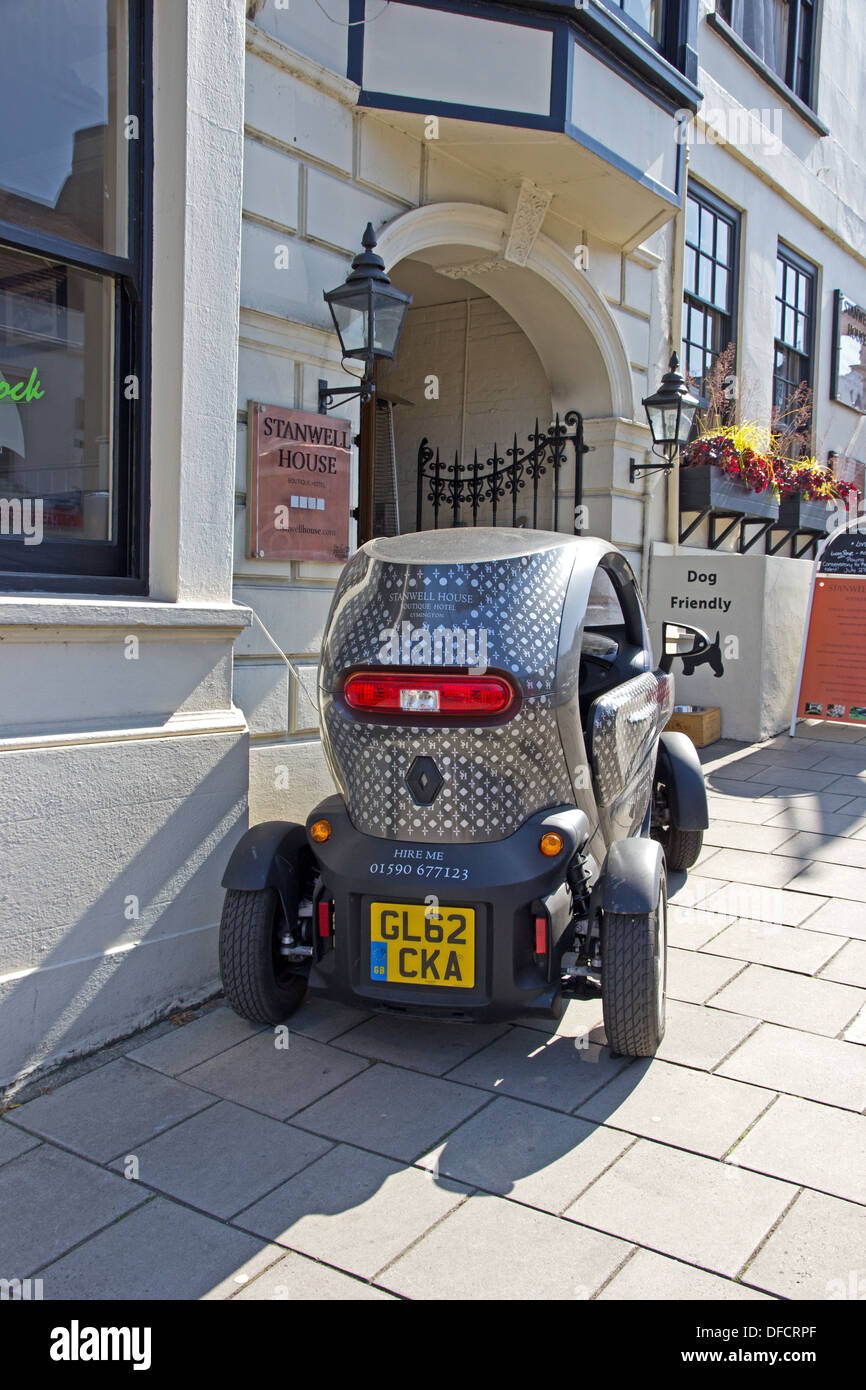 Renaul Twizy electric car charging batteries outside Stanwell House boutique hotel, Lymington Stock Photo