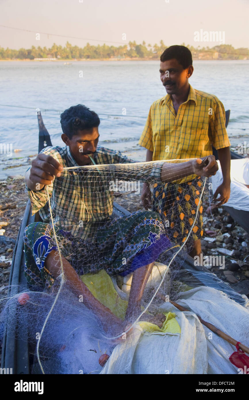 Fisherman working on a fishing net, Fort Cochin, Kerala Stock Photo Alamy