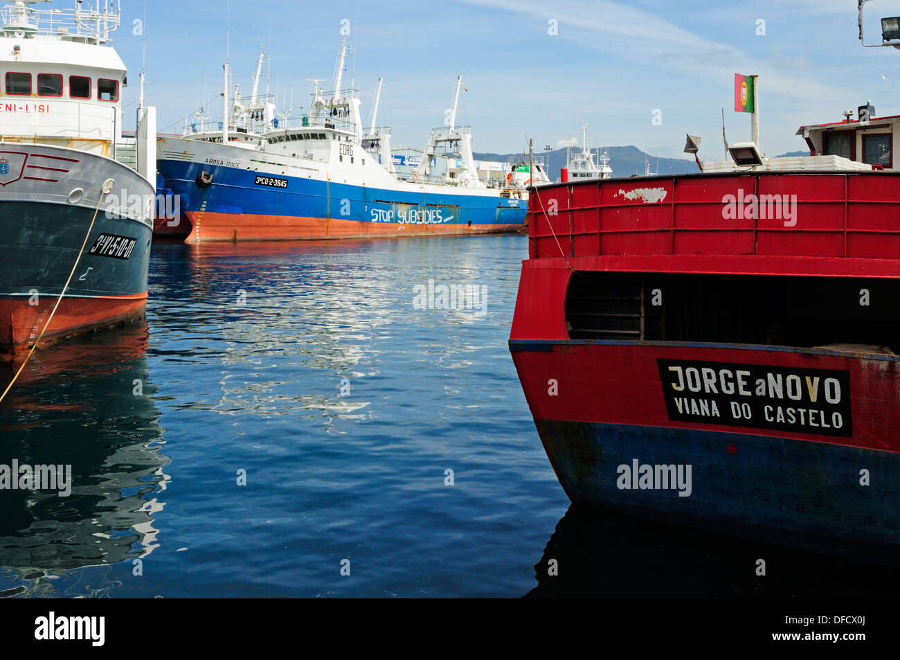 Fishing ships tied to the docks with an environmental graffiti on the hull. Vigo, Galicia, Spain Stock Photo