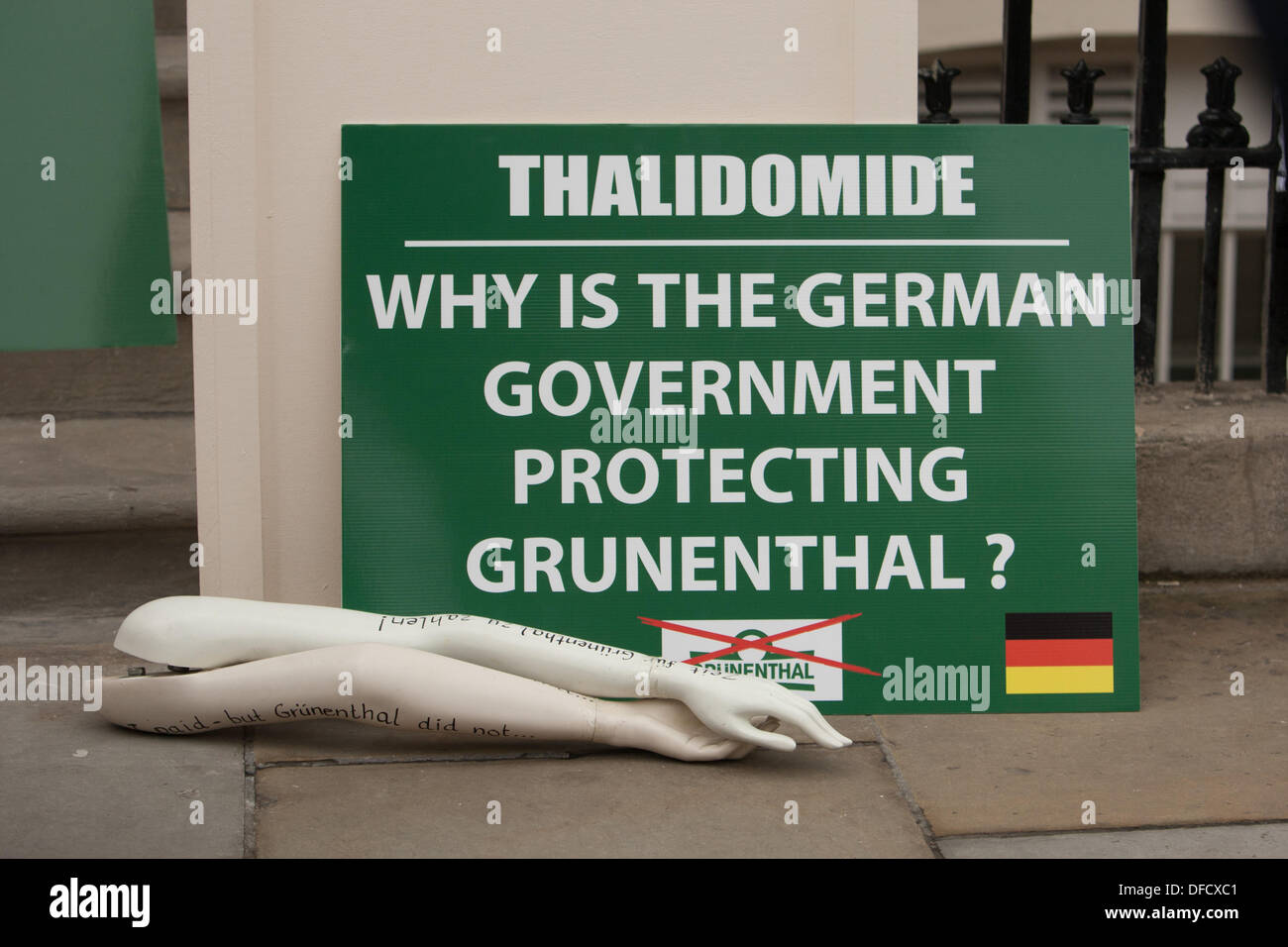 London, UK. 2nd October 2013. Placard and limbs outside the German consulate in Belgrave Square, highlighting the German government's protection of the pharmaceutical company Grünenthal from legal action by UK Thalidomide victims. London UK, 2nd October 2013. Credit:  martyn wheatley/Alamy Live News Stock Photo