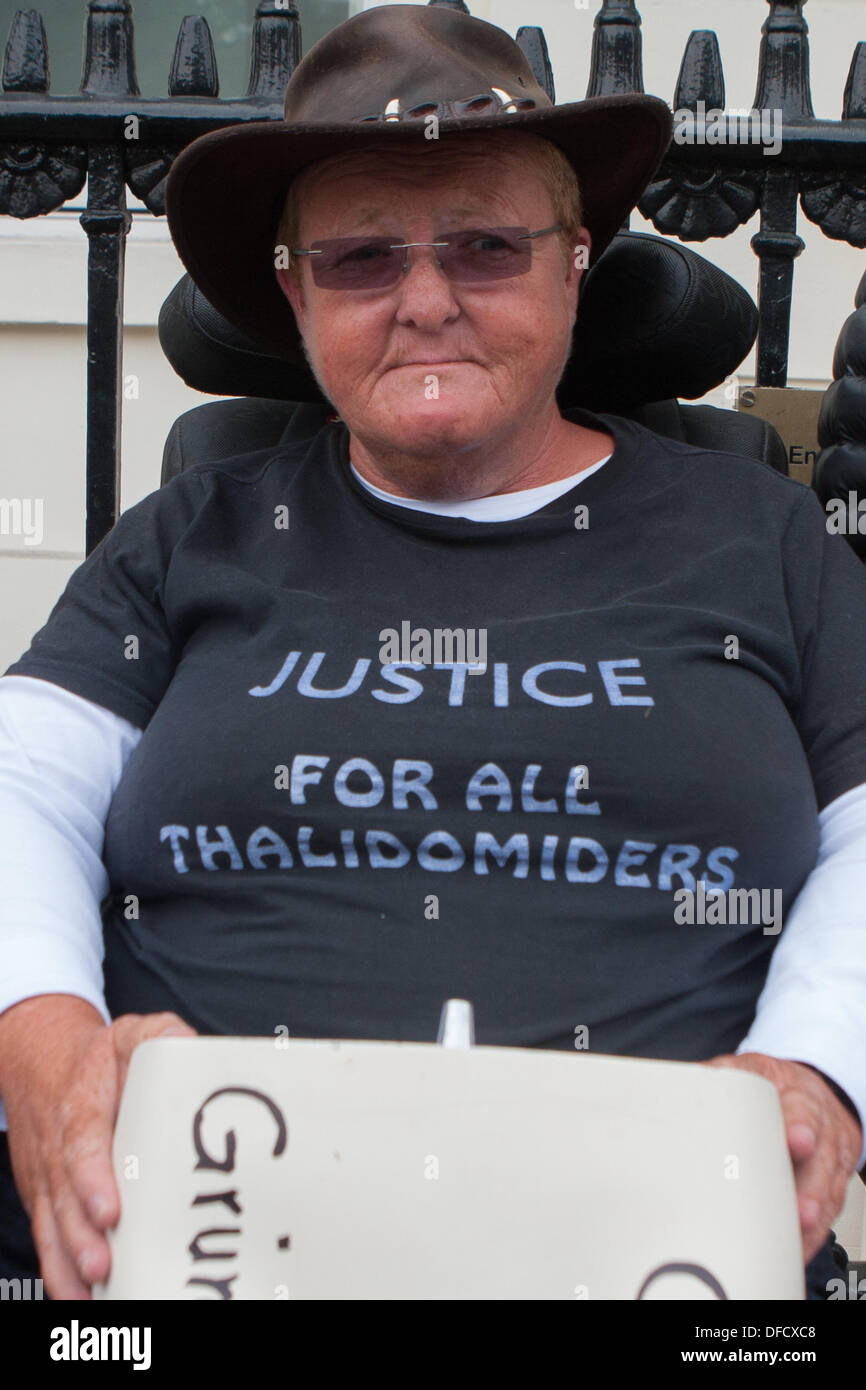 London, UK. 2nd October 2013. Thalidomide victim wearing 'Justice for all thalidomiders' outside the German consulate in Belgrave Square, highlighting the German government's protection of the pharmaceutical company Grünenthal from legal action by UK Thalidomide victims. London UK, 2nd October 2013. Credit:  martyn wheatley/Alamy Live News Stock Photo