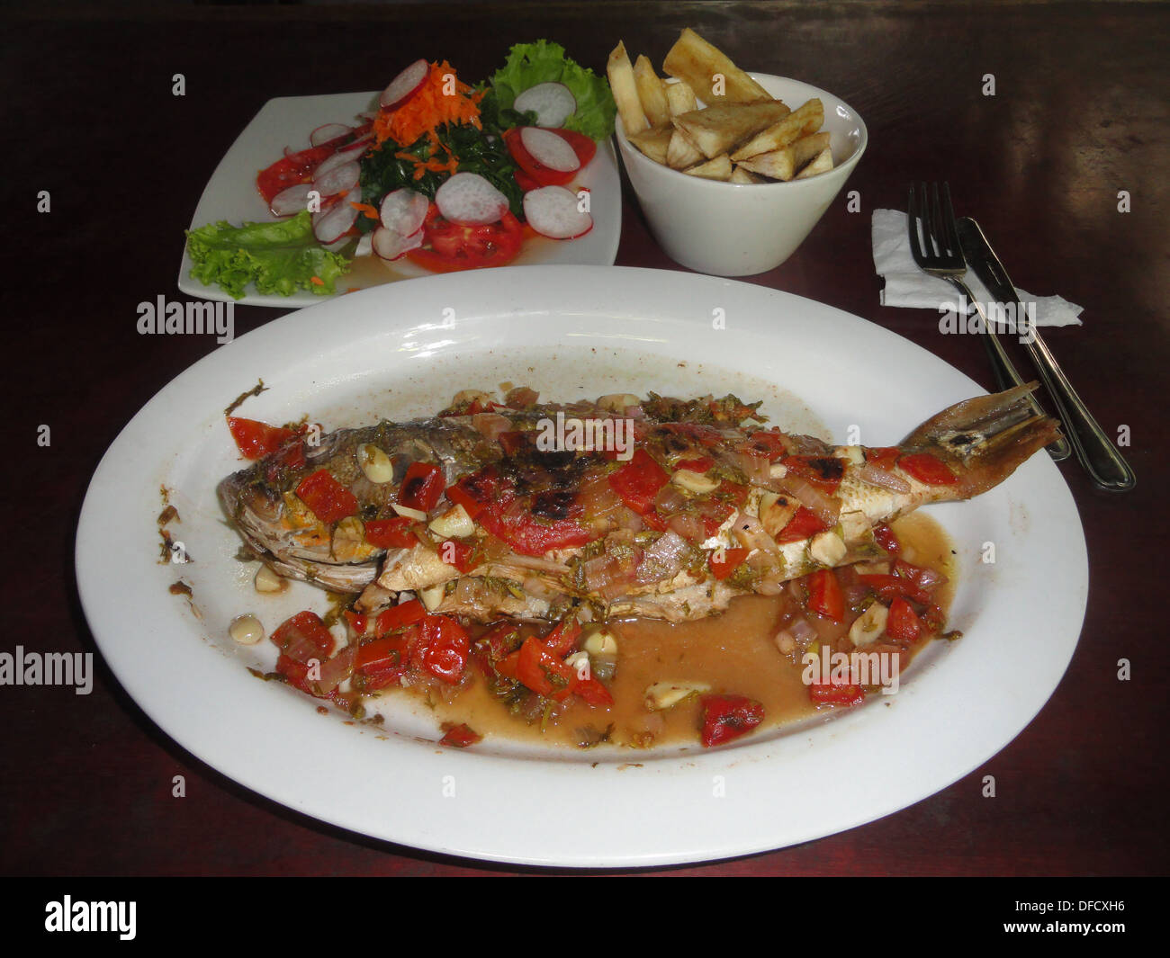 The traditional Amazonian fish dish 'Patarashca'. A whole fish, wrapped in banana leaves with