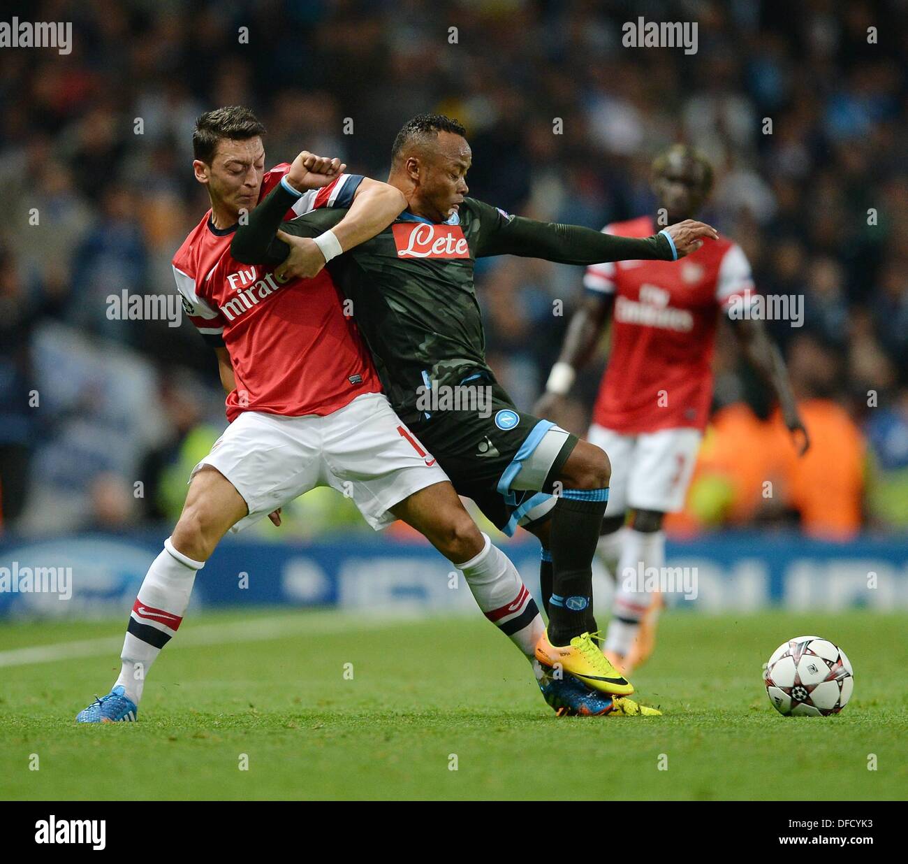 London, UK. 01st Oct, 2013. UEFA Champions League Group Stage fixture between Arsenal and SSC Napoli from the Emirates Stadium. Mesut Oezil left Arsenal against Camilo Zuniga SSC Naples © Action Plus Sports/Alamy Live News Stock Photo