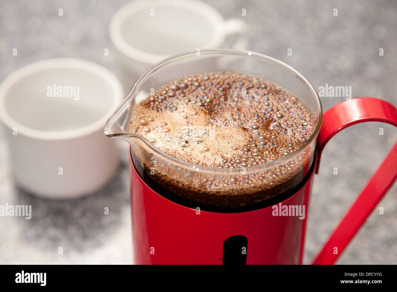 Ground coffee in a red cafetiere Stock Photo Alamy