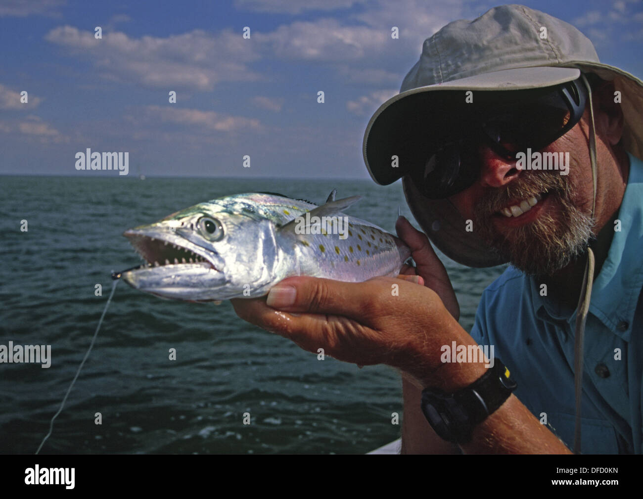 Florida fisherman holding a Spanish mackerel in Charlotte harbor Stock