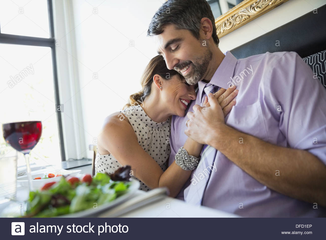 Romantic couple sitting in restaurant Stock Photo Alamy