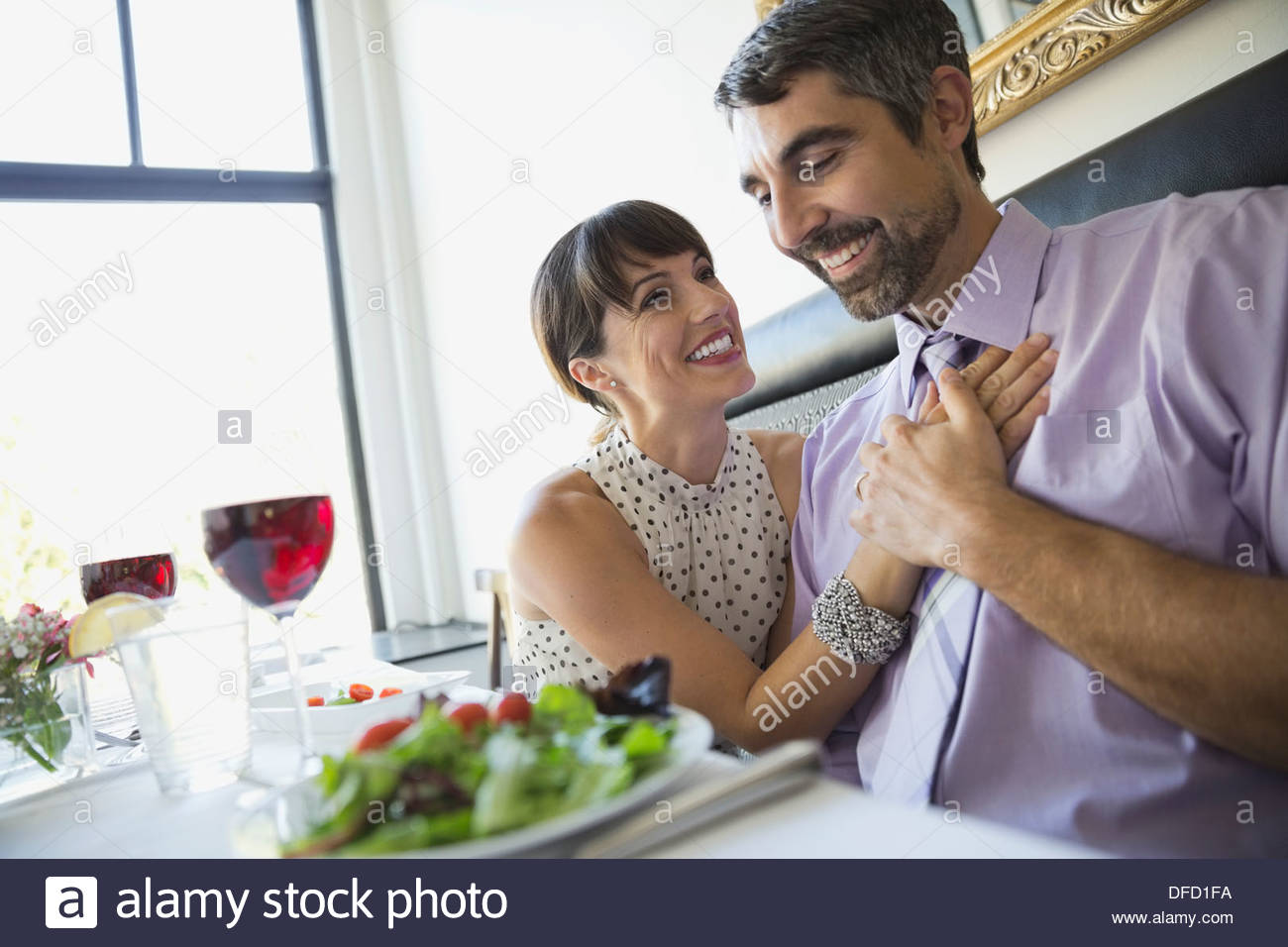 Romantic couple sitting in restaurant Stock Photo Alamy