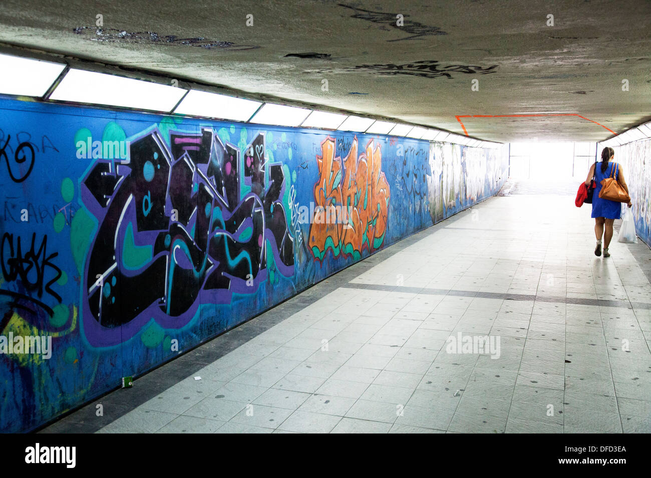Commuters admiring art in Madrid subway station