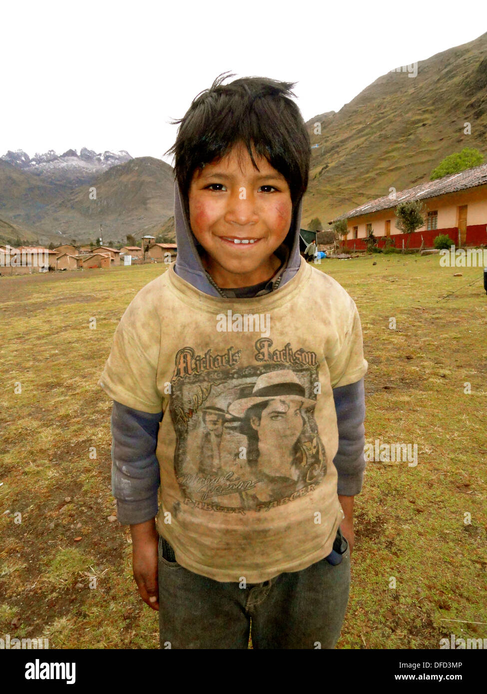 A local boy smiles for a photo along the Lares trail near Cusco, Peru Stock Photo