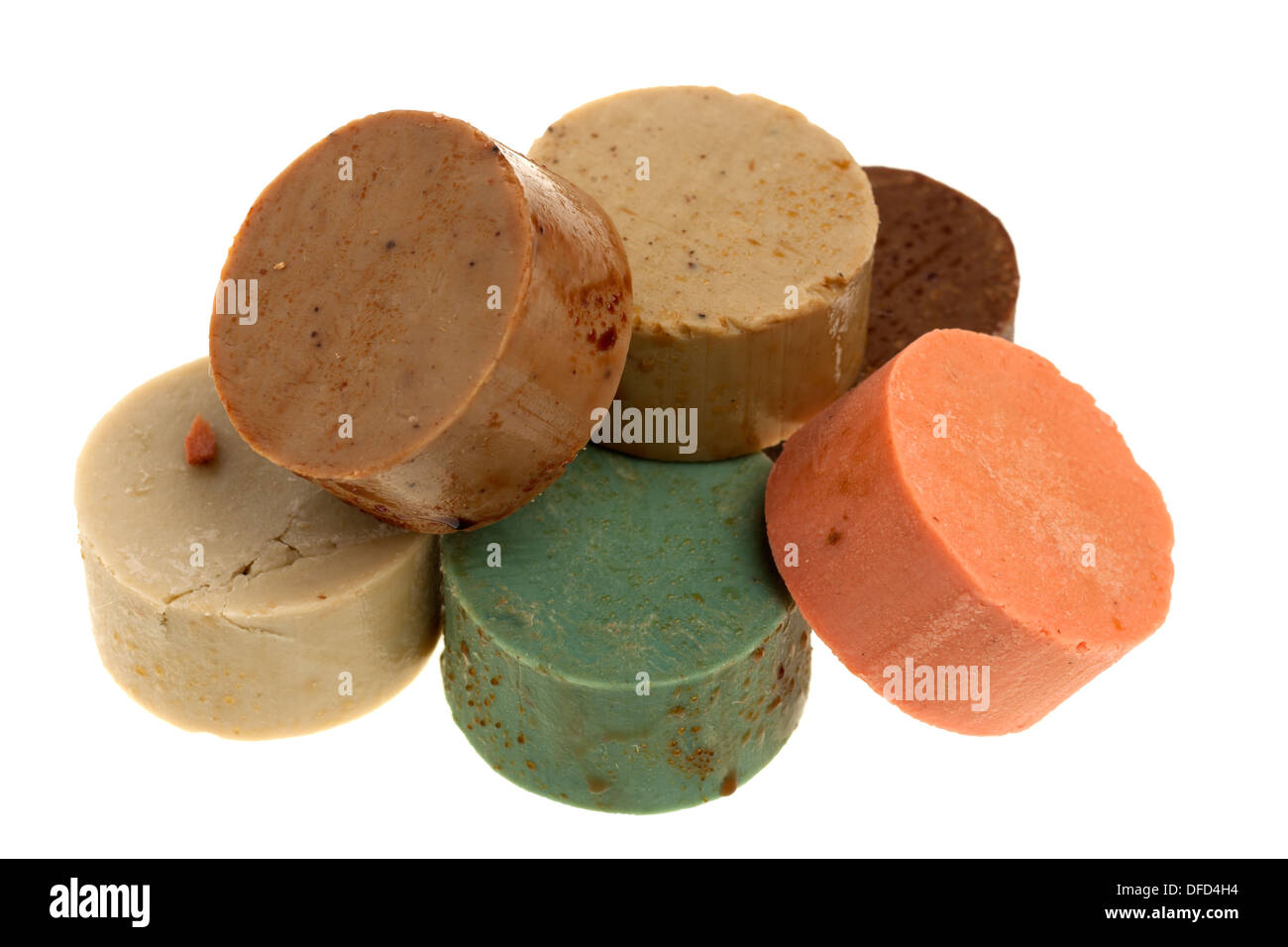 Pile of six mixed circular oily soaps Stock Photo