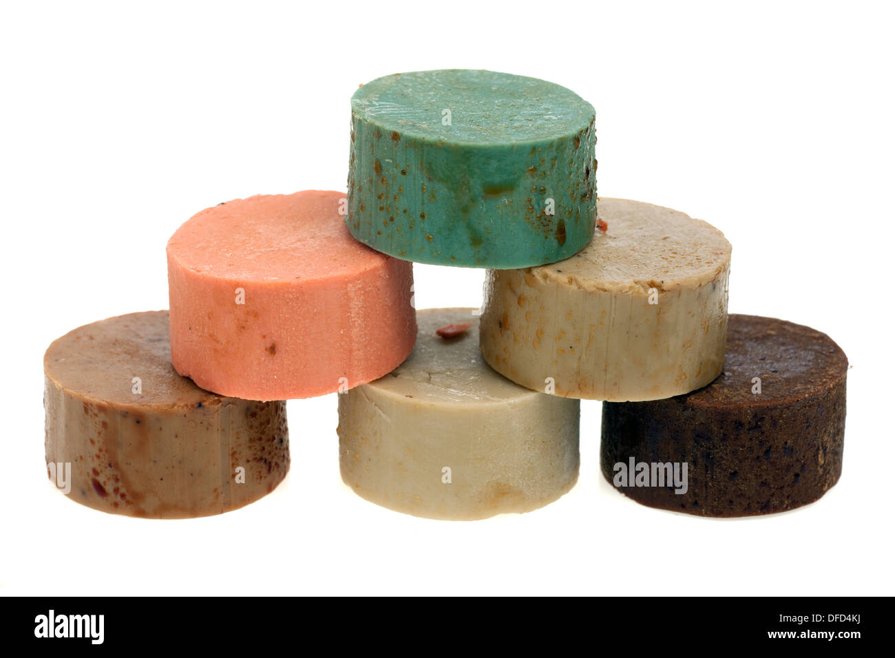 Stack of six mixed circular oily soaps Stock Photo