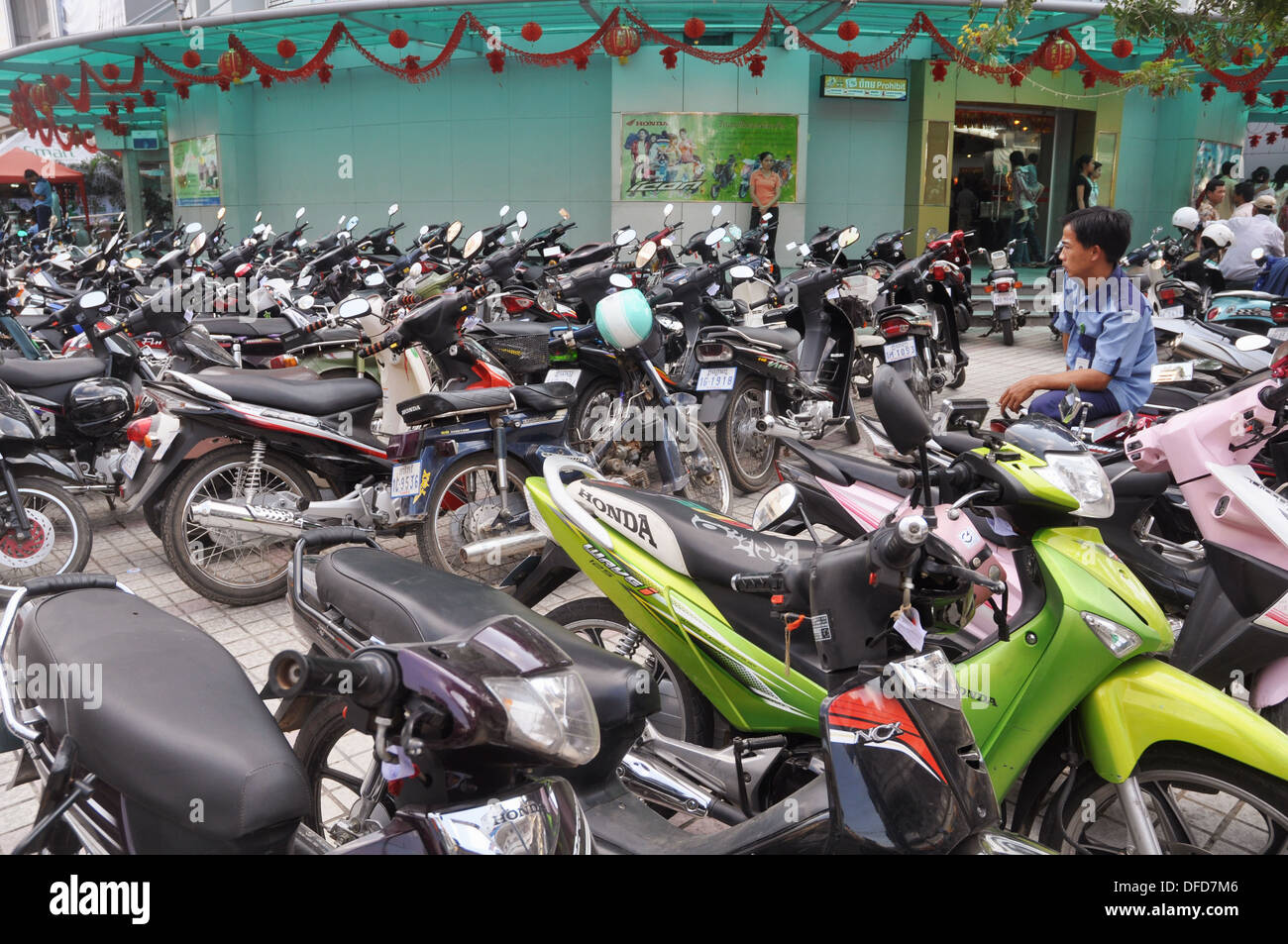 Phnom Penh (Cambodia) a parking lot packed with motorbikes Stock