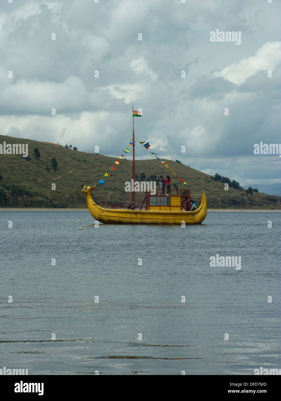 A traditional reed boat sailing on Lake Titicaca near the town of ...