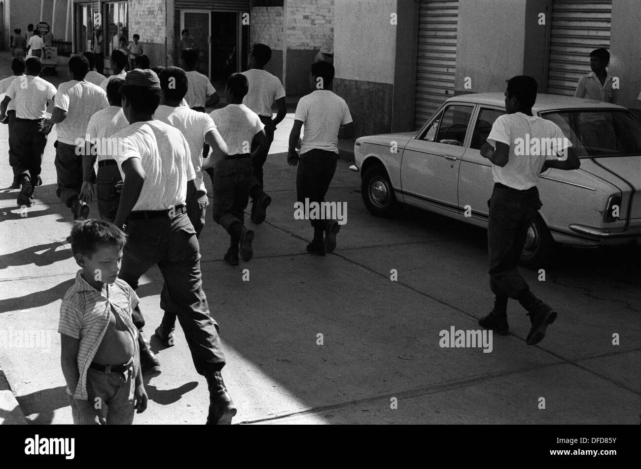 Puntarenas Costa Rica Central America, soldiers exercising running through the streets to keep fit. 1970s 1973 HOMER SYKES Stock Photo