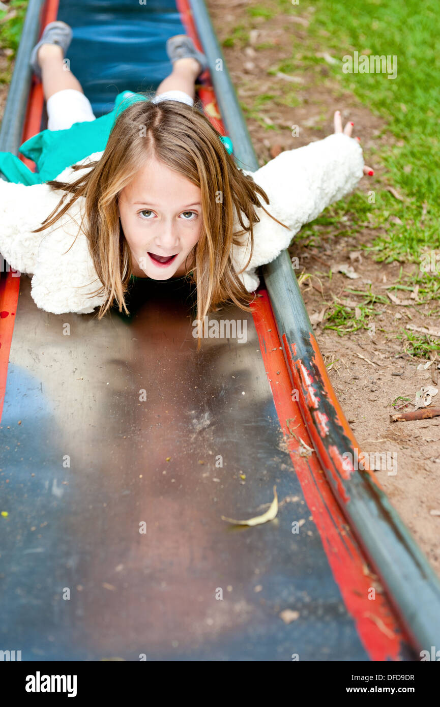 Little girl sliding down slide hires stock photography and images Alamy