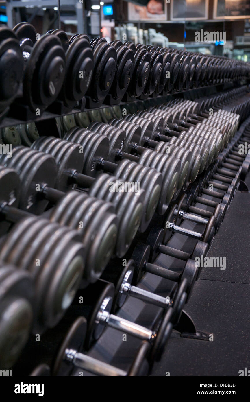 Image of a full weight rack for free weights at a commercial gym Stock  Photo - Alamy