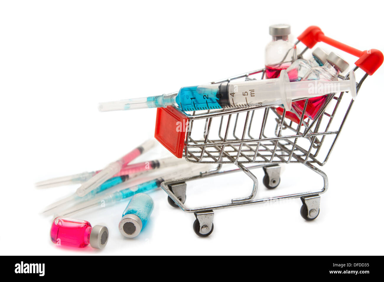Shopping cart with medicine vials and syringe Stock Photo